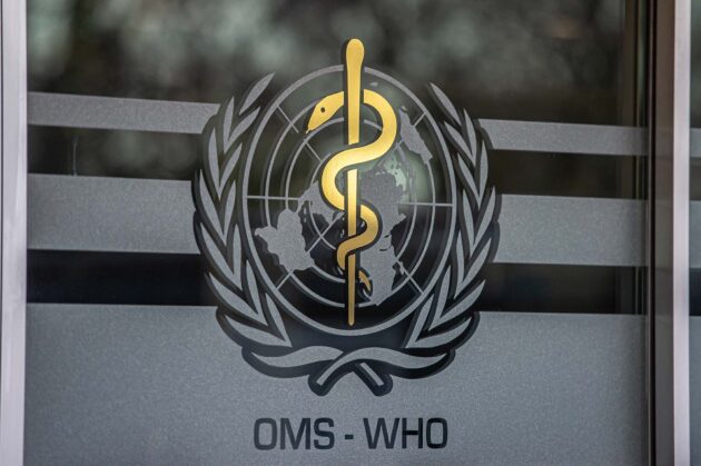 The logo of the WHO is seen on headquarters entrance of the World Health Organization (WHO).