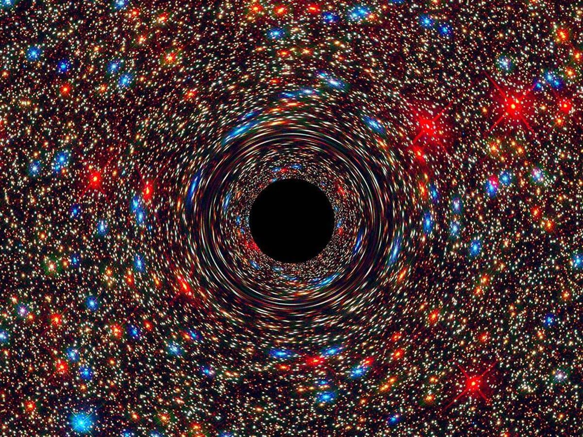 A black hole at the center of a galaxy, surrounded by swirling stars and cosmic dust, illustrating its immense gravitational pull.