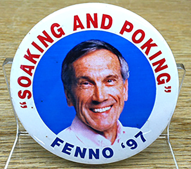 A fenno pin displayed on a neutral background, highlighting its sleek design and sharp end for fastening purposes.