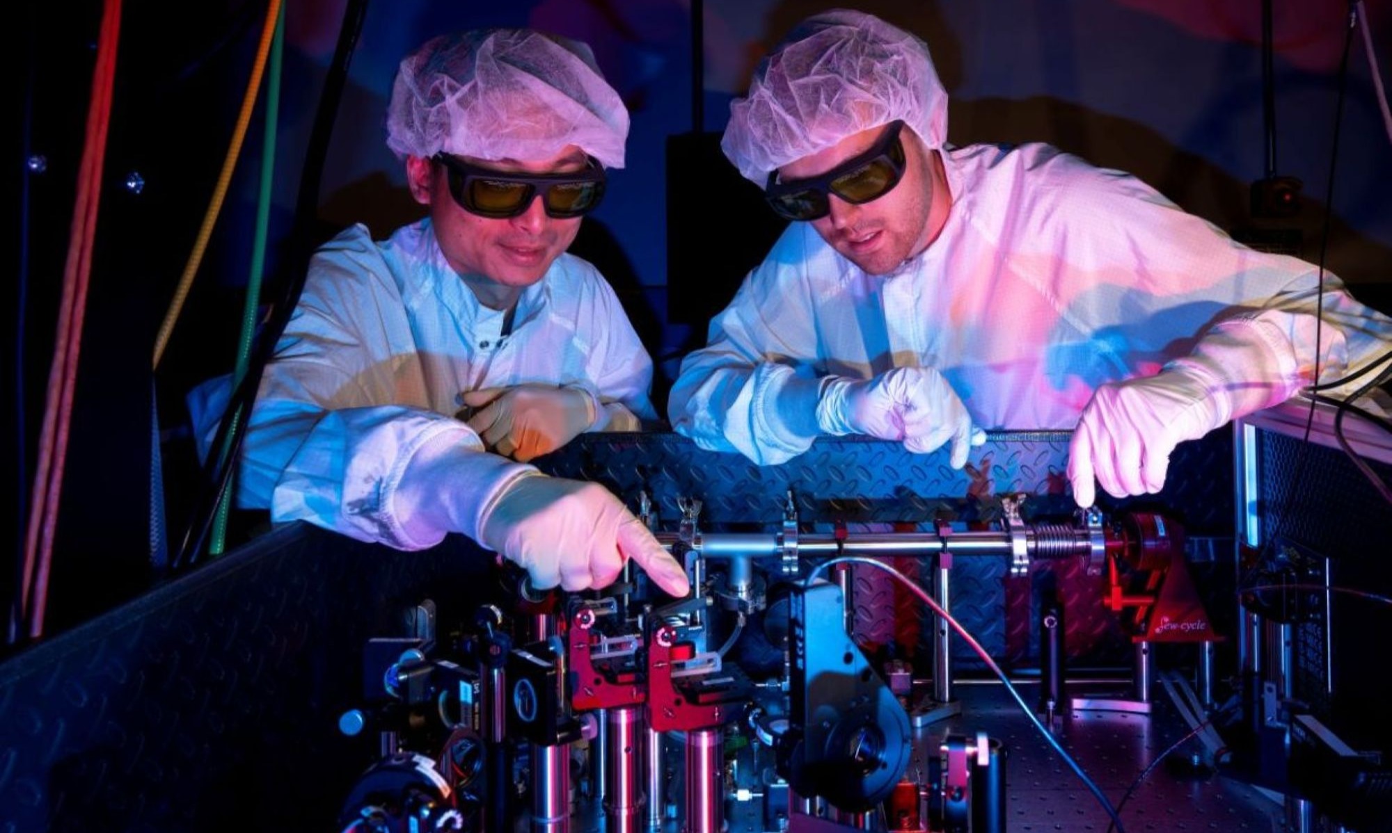 Student and mentor working in a high-power lab at the Laboratory for Laser Energetics