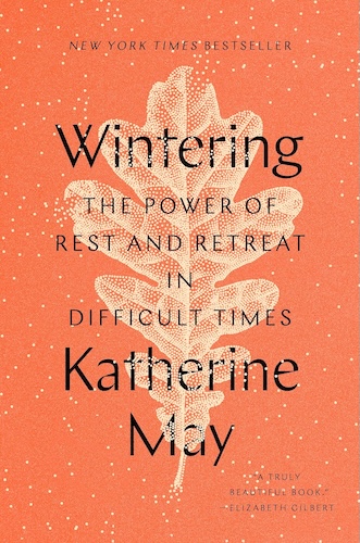 Wintering by Katherine May book cover with white leaf on an orange background.
