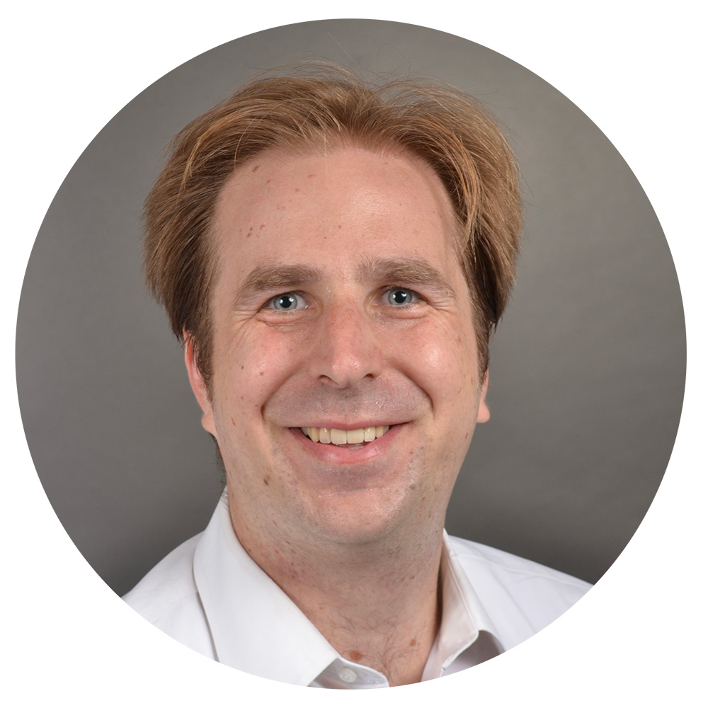 Circle cutout of a headshot of Scott Grimm.