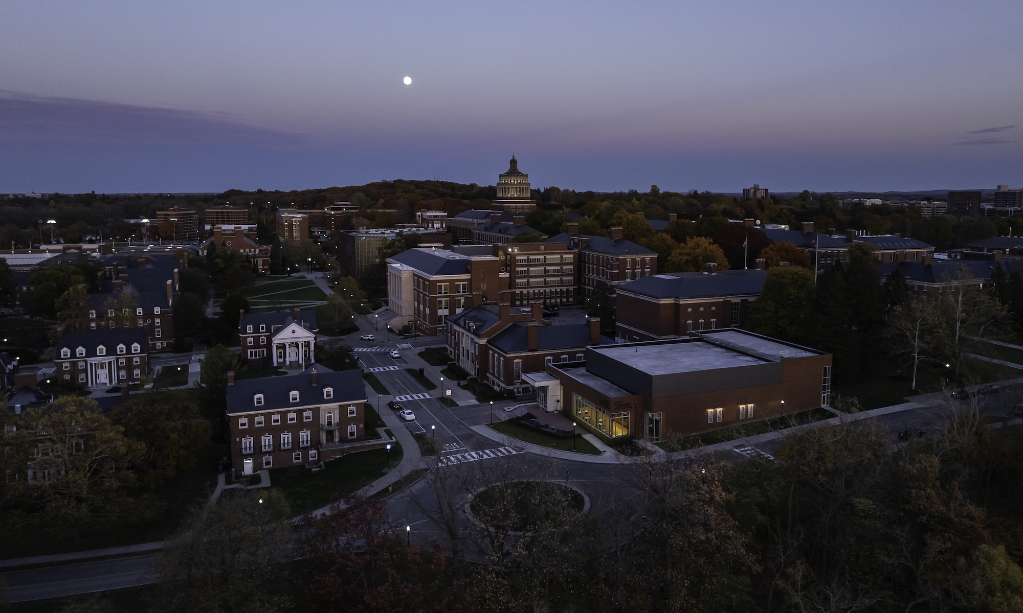 A full moon rises over University of Rochester’s River Campus as seen via aerial drone.