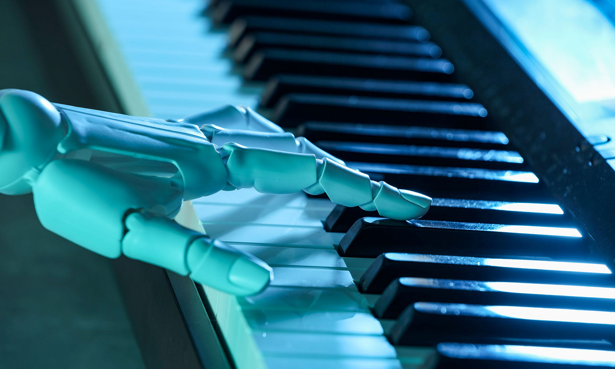 A robotic hand playing a synthesizer while bathed in blue light to illustrate the question "can AI make music?"