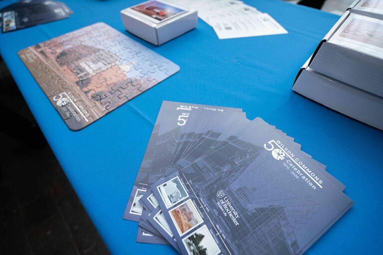 Close up of a table displaying materials marking the 50th anniversary of Wilson Commons.