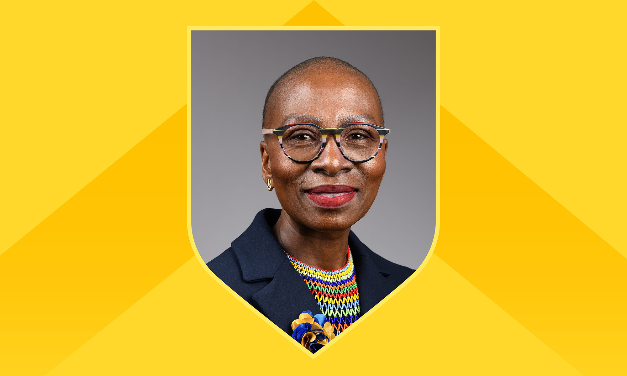 Portrait of Reitumetse Mabokela in a shield frame against a yellow background with a darker yellow chevron.