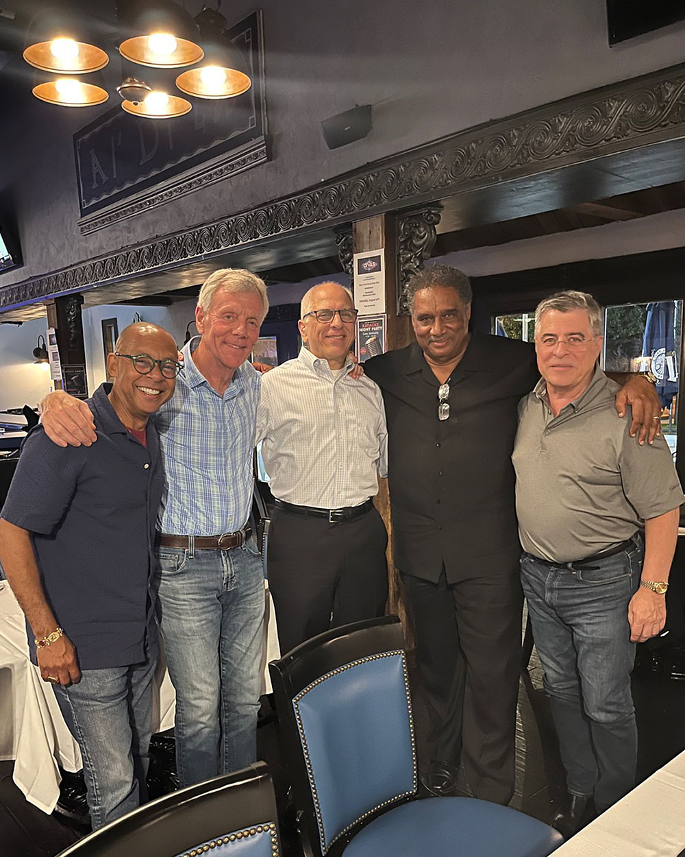 Five members of Broad Street Stroke reunited at a restaurant in 2023.