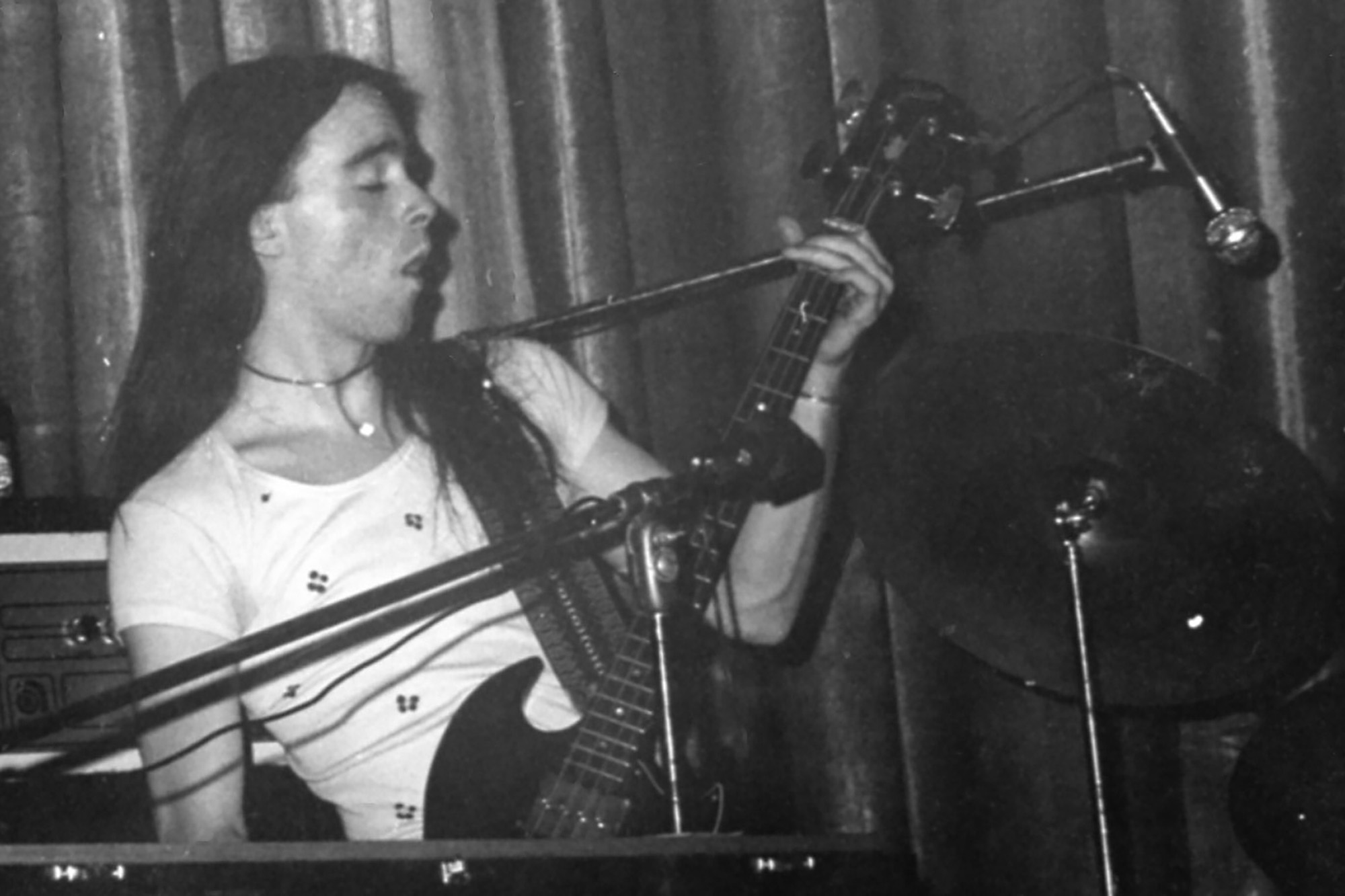 Clint Conley plays bass guitar on stage during a Broad Street Stroke performance.