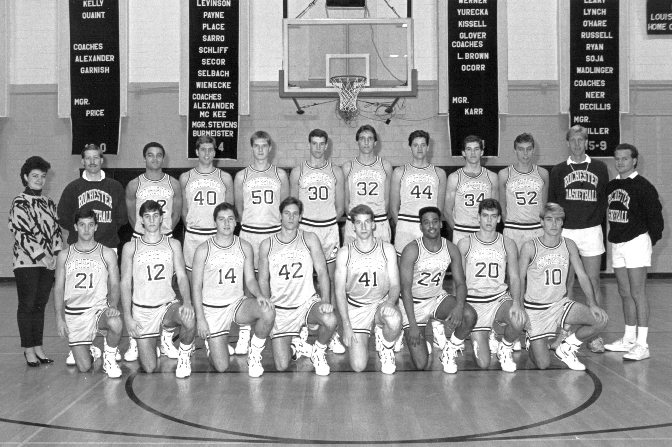 Team photo of the 1990 University of Rochester men's basketball championship squad posed in two rows in a gymnasium.