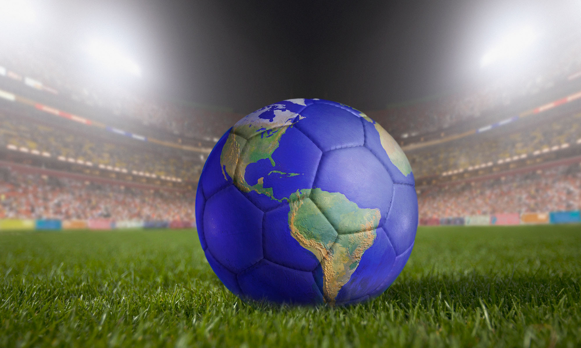 Soccer ball on a pitch with the stadium blurred in the background. The ball looks like the globe to indicate world history as it relates to the World Cup.