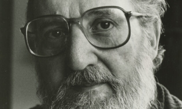 Extreme close-up horizontal crop of a black and white vertical archival photo of Carl Chiarenza.