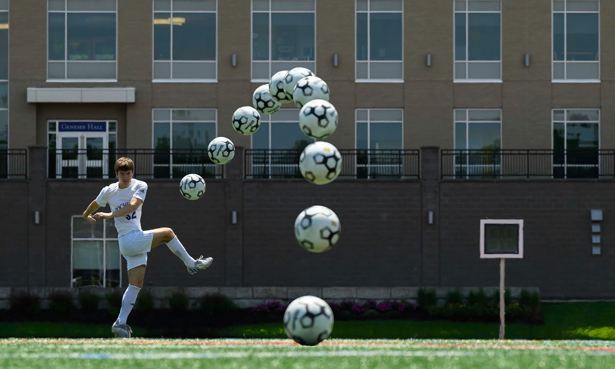 URochester men's soccer team player Johnny Makula curves a soccer ball during a kick to demonstrate the Magnus effect.