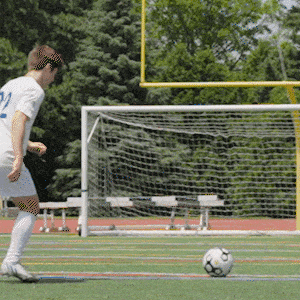 GIF of a URochester student showing how to curve a soccer ball.