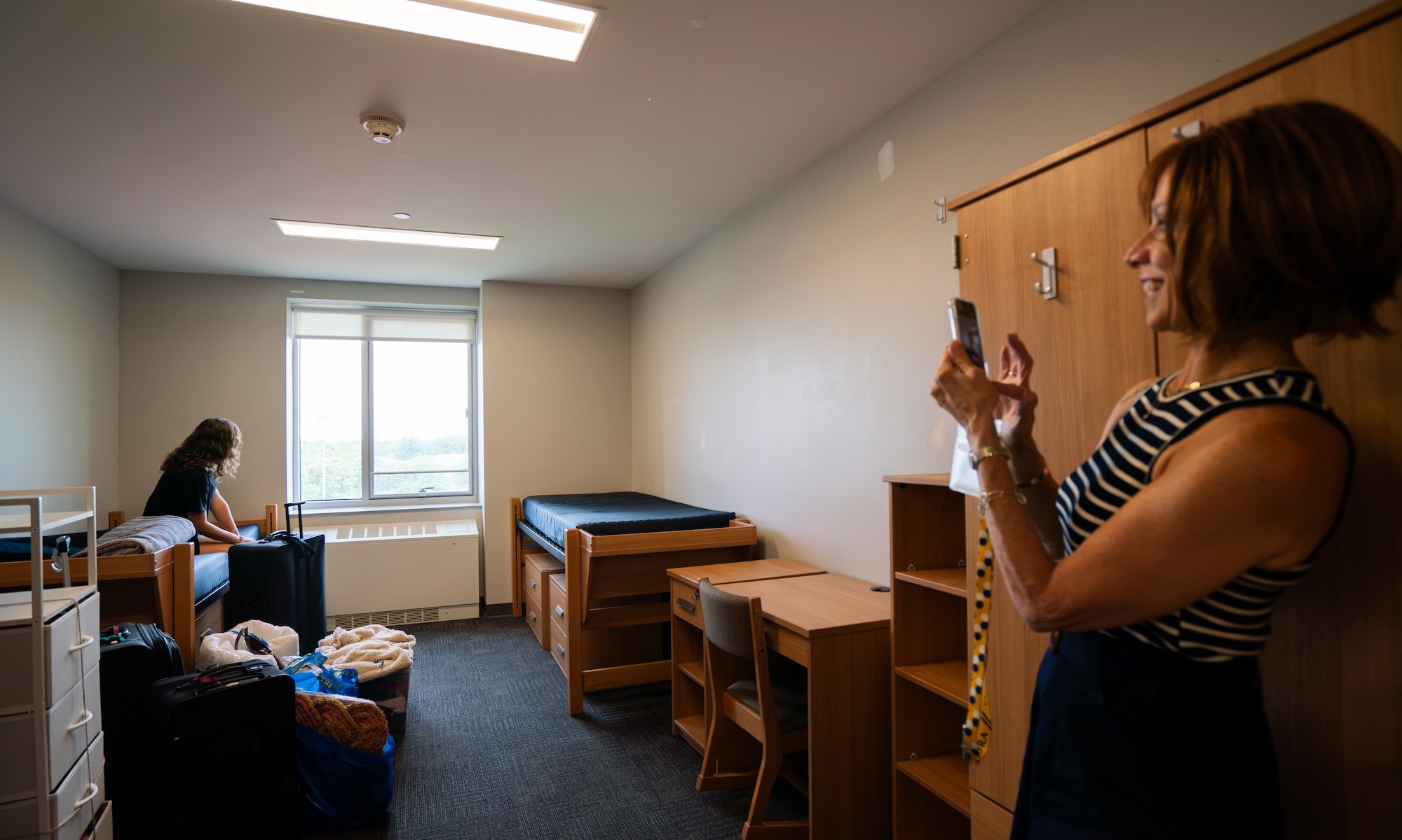 Kayra Ustunkok ’30 and her mother unpack and organize her room in Genesee Hall
