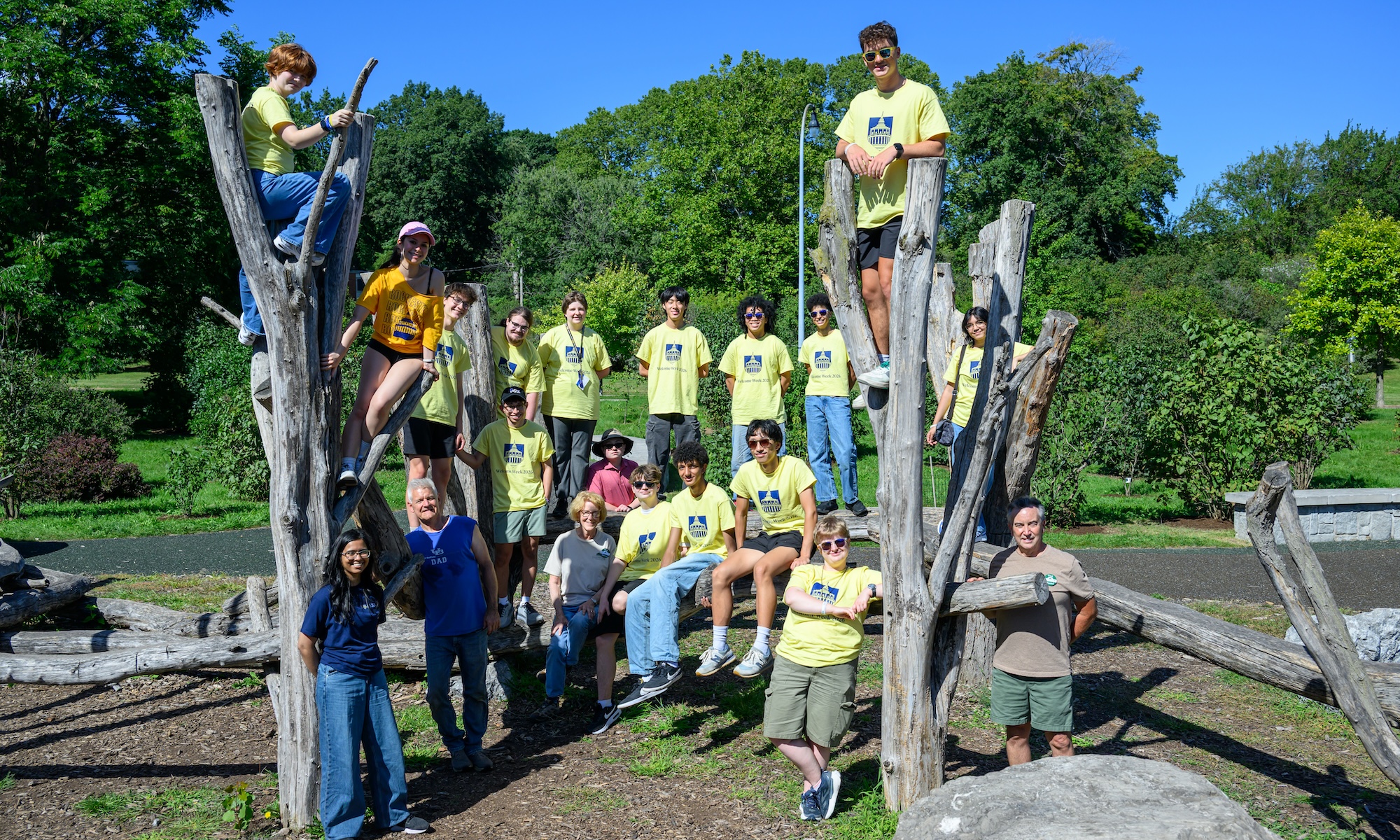 Class of 2030 students weed and mulch lilacs at the Lilac Adventure Zone at Highland Park with members of the Highland ParkConservatory during Wilson Day.