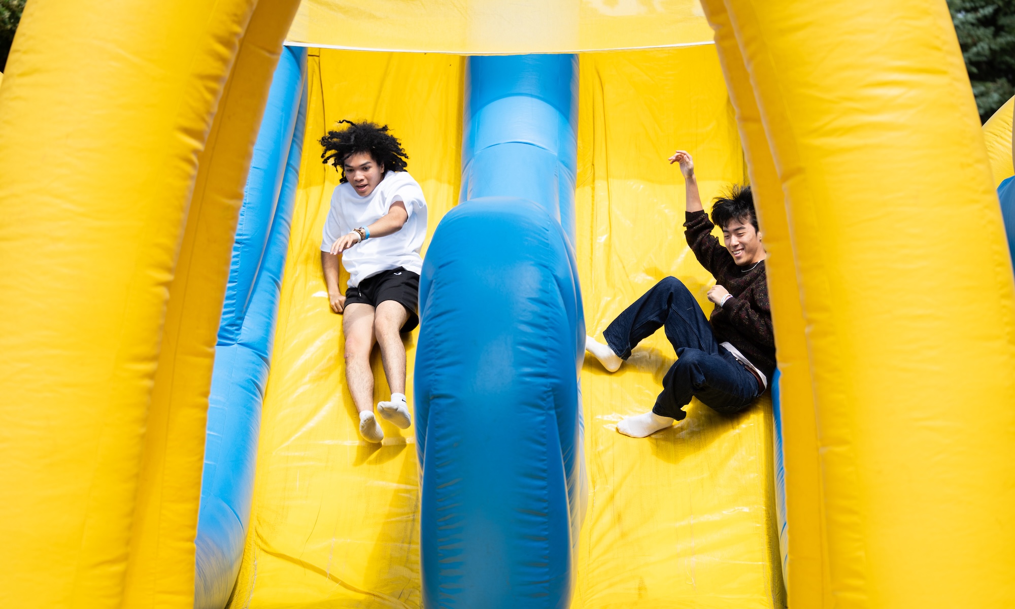 Students take part in games, inflatable activities, and outdoor recreation during Field Day.