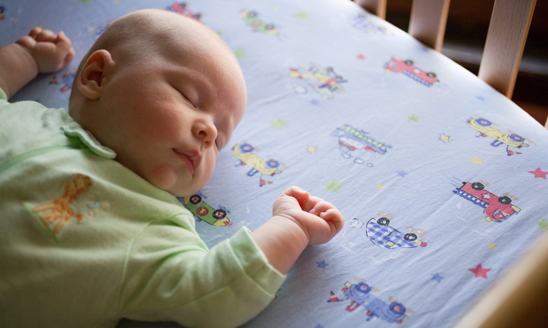 Baby sleeping safely in crib.