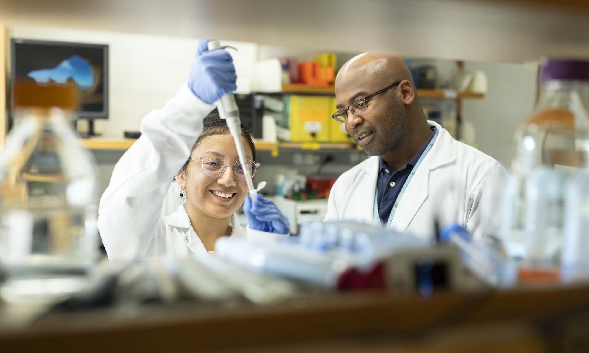 URochester PhD student and advisor in a lab to illustrate how to choose a PhD program and advisor.
