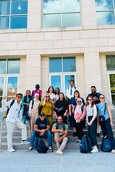 Group photo of the 2026 Fulbright Teachers in front of the Warner School of Education's building.