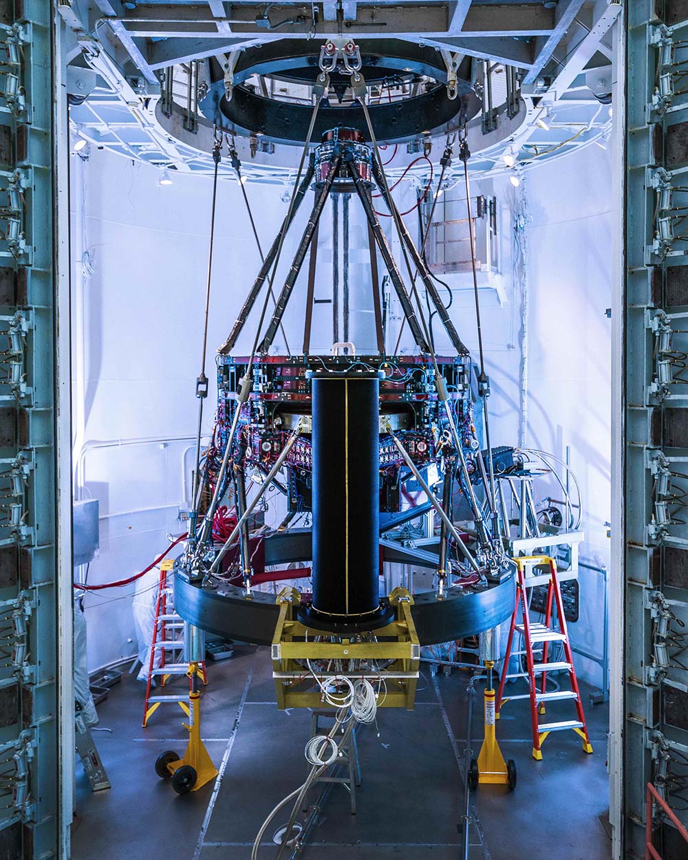 The Nancy Grace Roman Space Telescope's Imaging Optics Assembly suspended vertically inside a clean room at L3Harris Technologies in Rochester, New York.