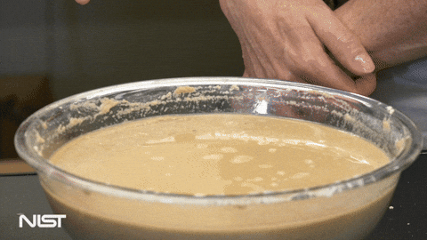 GIF of a fist punching oobleck, which hardens with the force of the punch.