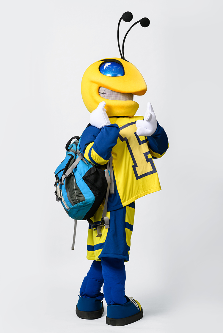 Mascot Rocky sporting a blue backpack.