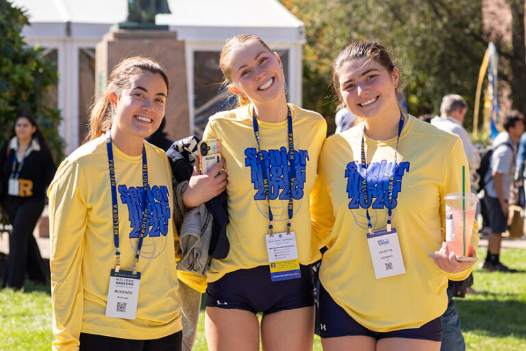 Three undergraduate women in yellow 
