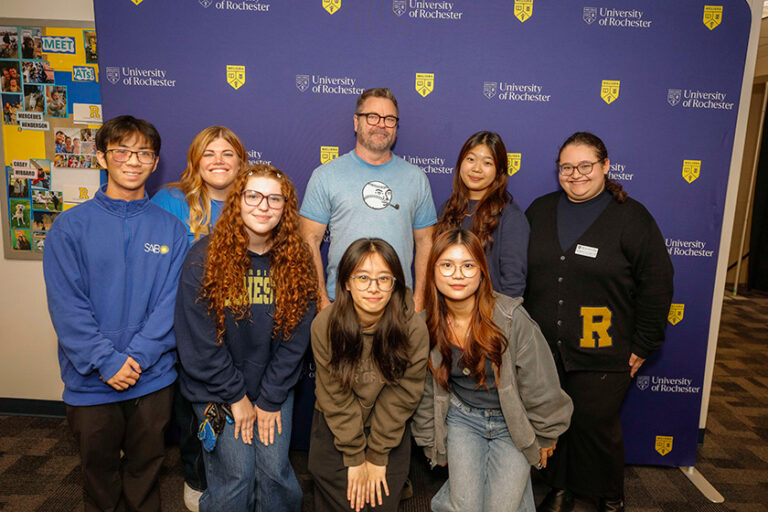 Nick Offerman poses with URochester students for a group photo during Meliora Weekend 2026.
