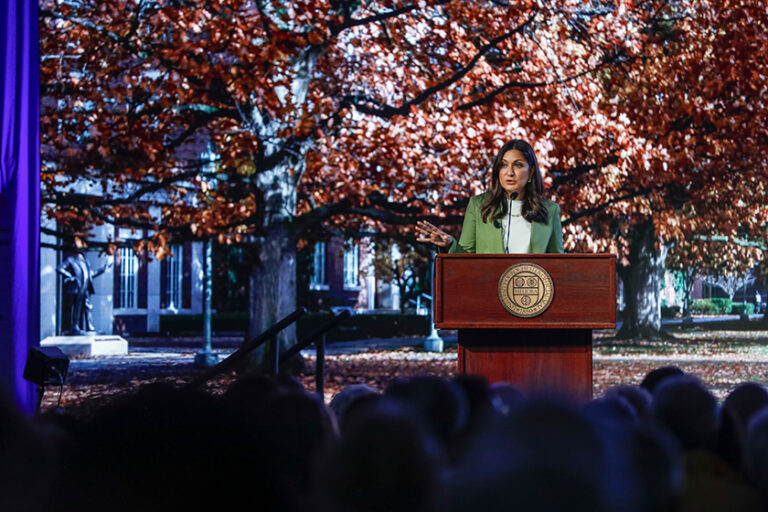 Amna Nawaz on stage during her presentation at the University of Rochester.