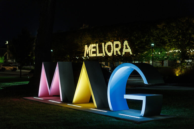 The MAG letters in front of the Memorial Art gallery light up at night with a giant MELIORA light installation nearby.
