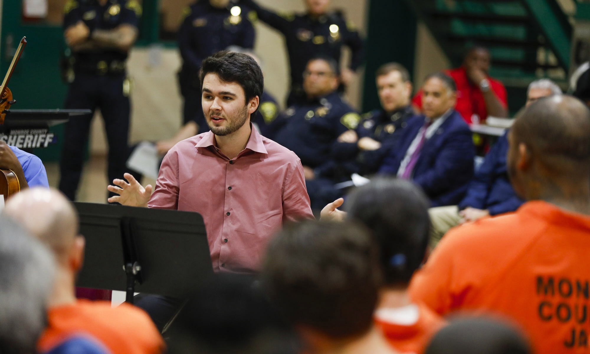 Aiden Hughes addresses the inmates who make up the audience.