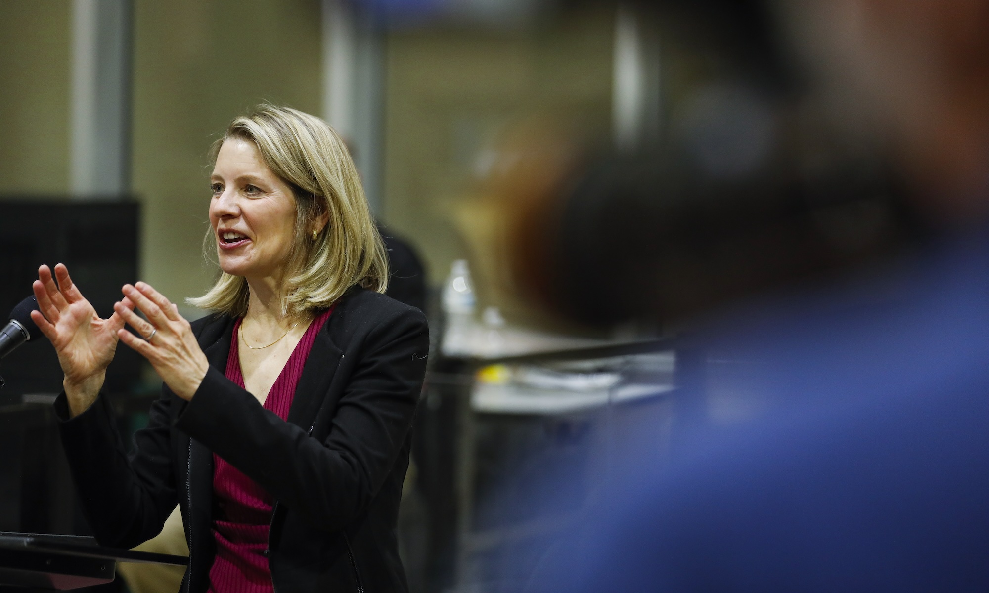 Elinor Freer speaks and gestures to the inmates at the Monroe County Jail.