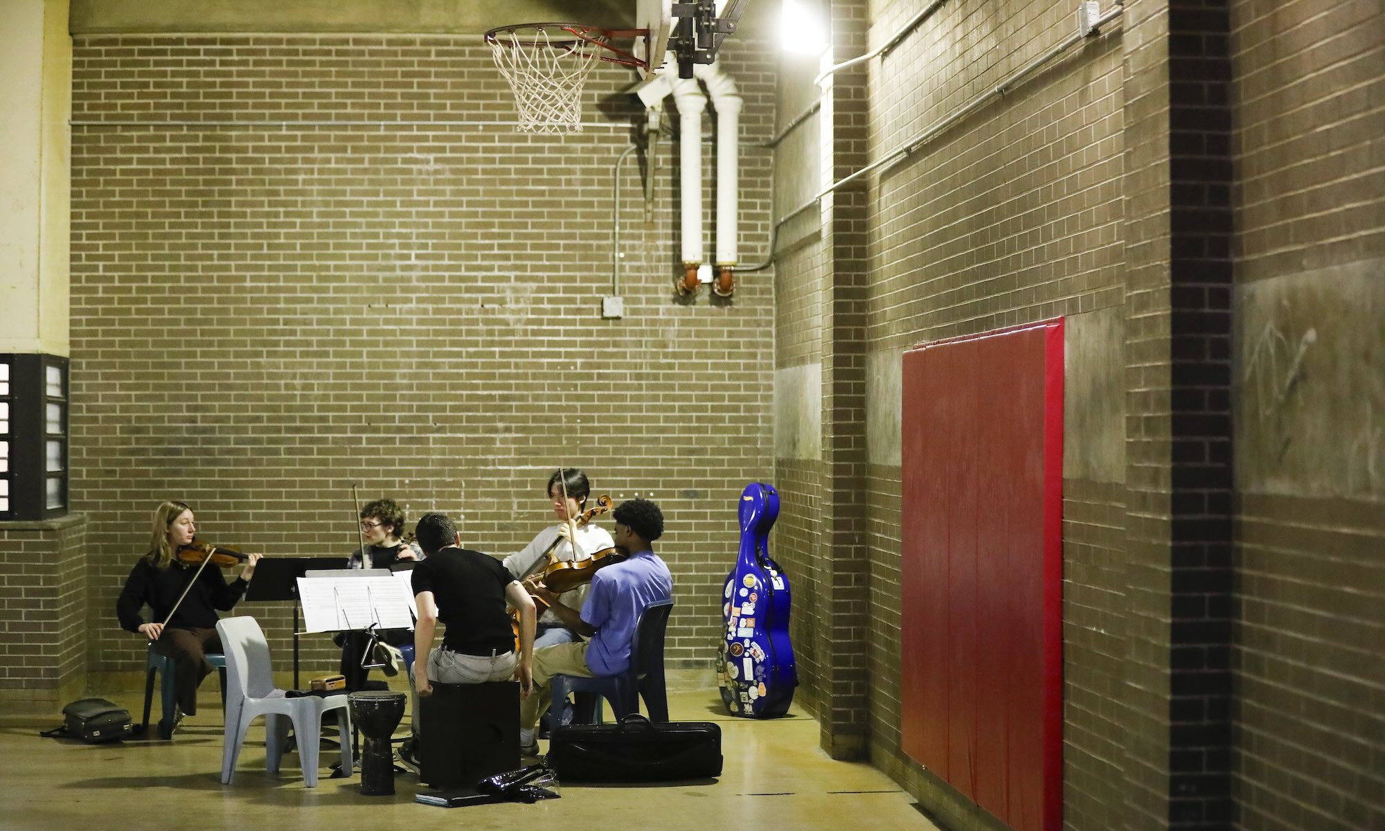 Five Eastman School of Music students practice in the gymnasium at the Monroe County Jail.