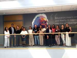 A group of business professionals pose for the camera