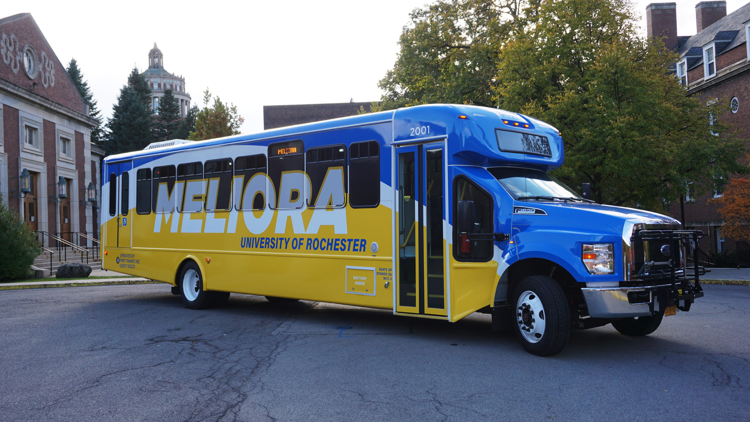 University of Rochester shuttle bus with new blue and yellow wrap