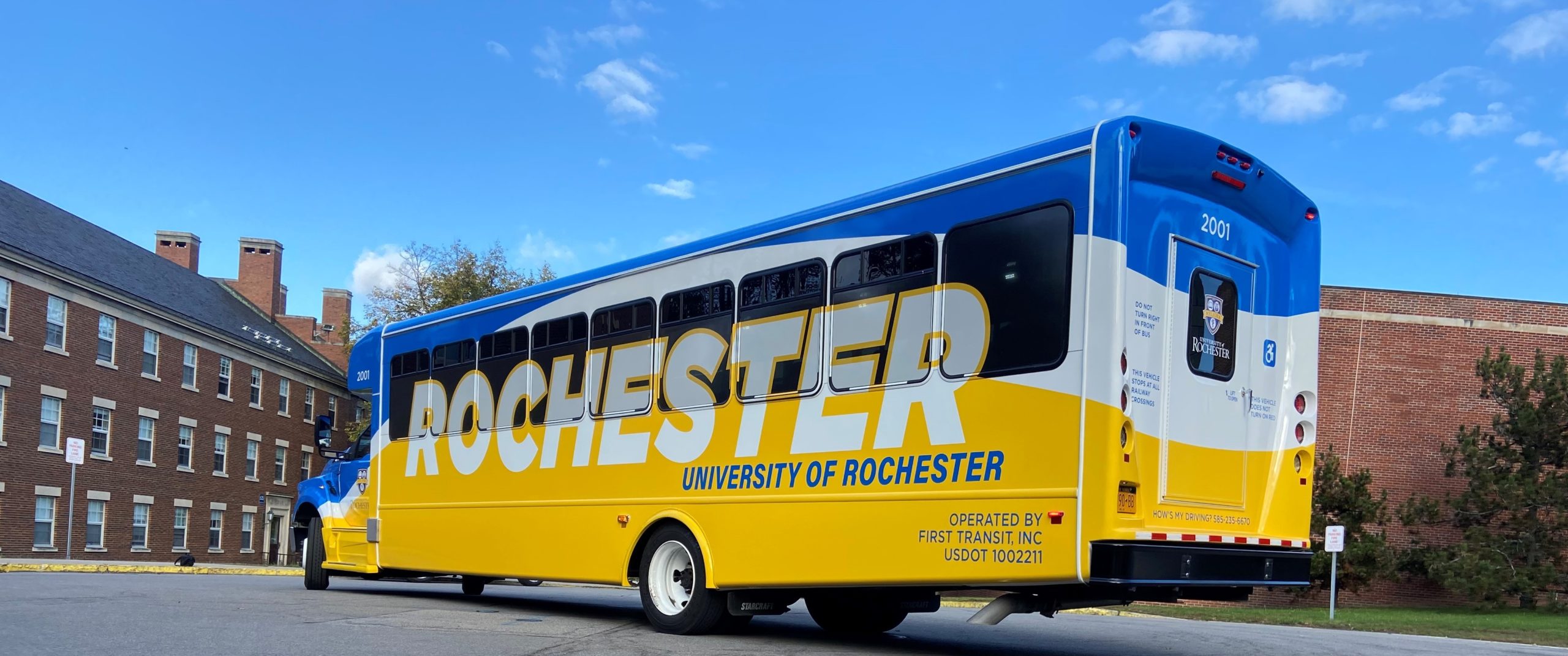 University of Rochester shuttle bus with new blue and yellow wrap
