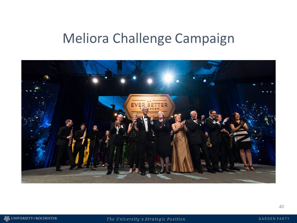 People on stage in formal wear, applauding