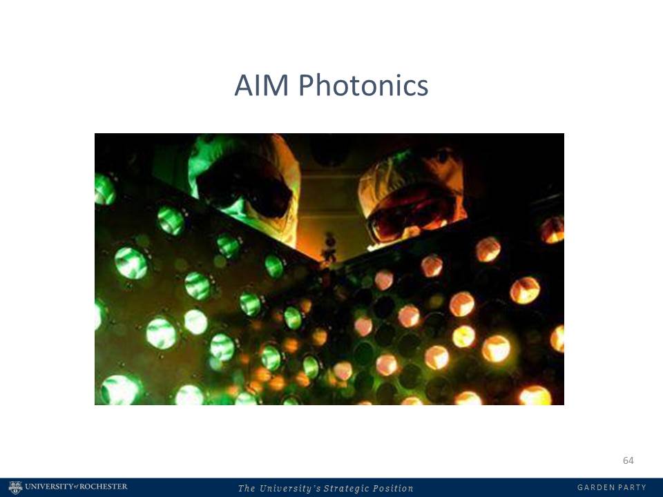 people in goggles looking at light through metal with holes