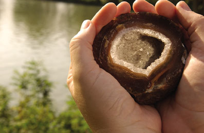 hands holding a geode