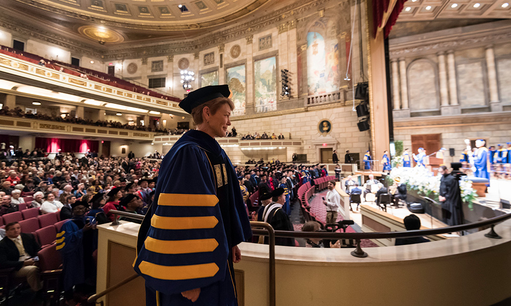 Sarah C. Mangelsdorf makes her way to the stage during her inauguration ceremony in Kodak Hall at Eastman Theatre.