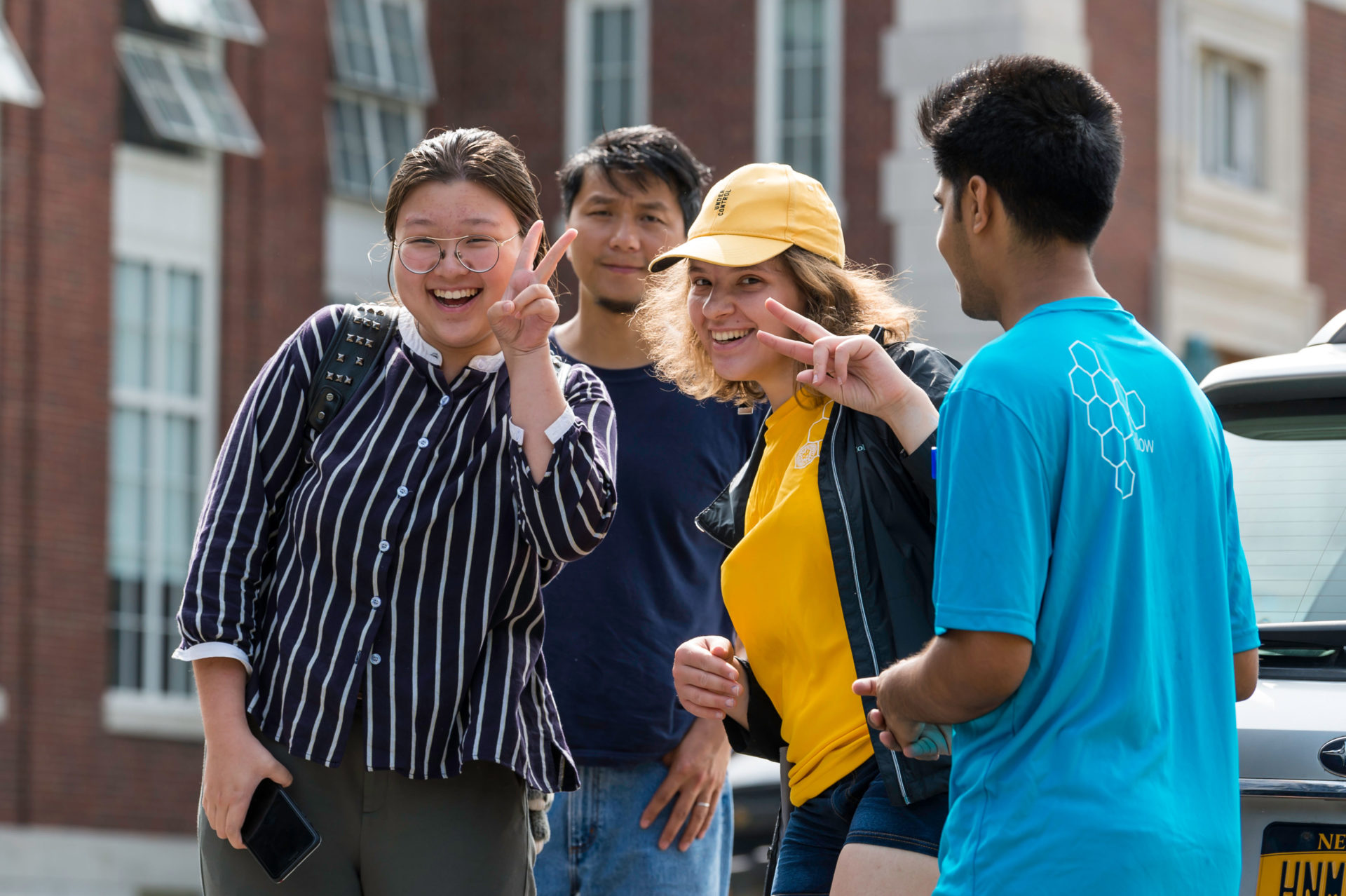 A group of University of Rochester students posing for the camera and smiling