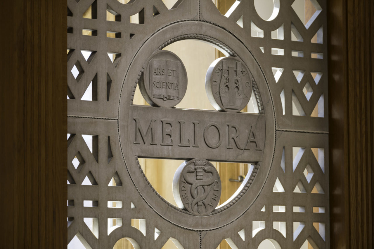 Meliora seal inside Hawkins-Carlson Room in Rush Rhees Library