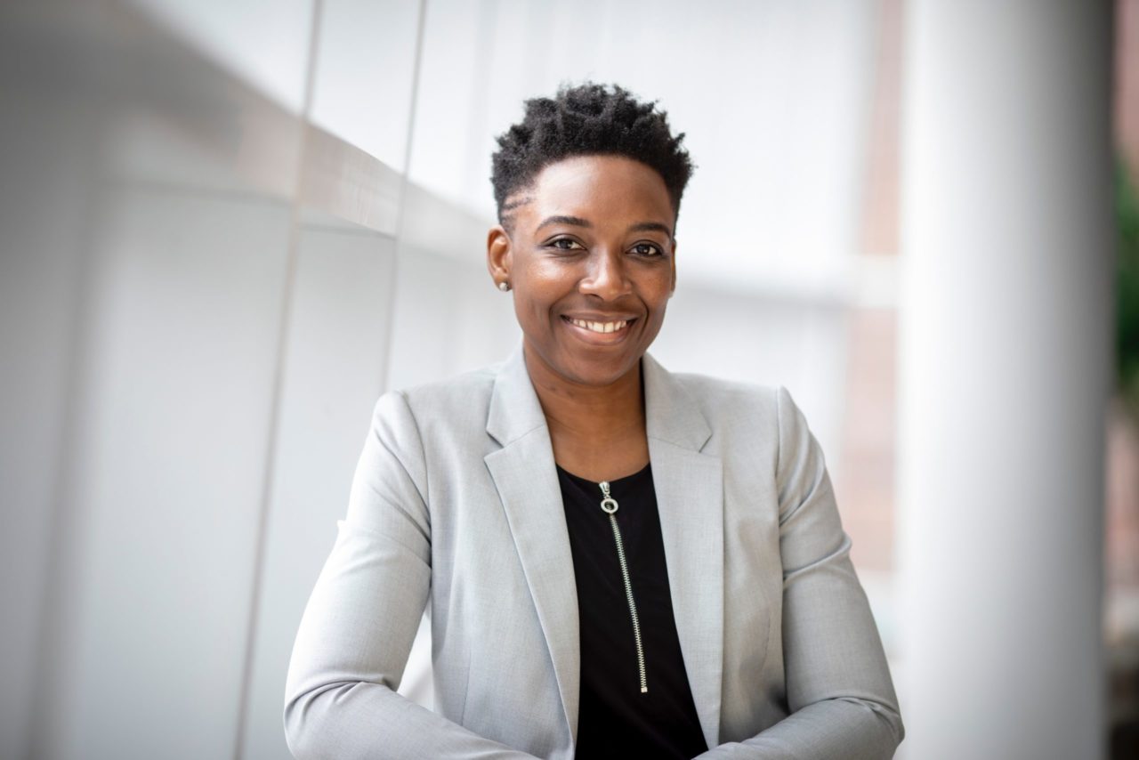 A portrait of a woman wearing business attire