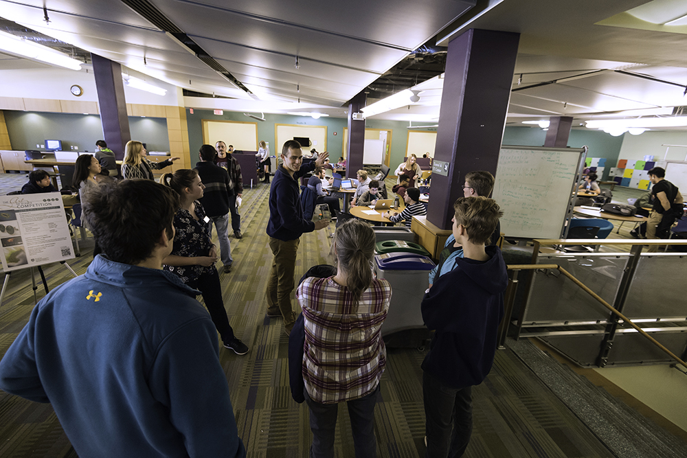 A tour group walking through a common area.