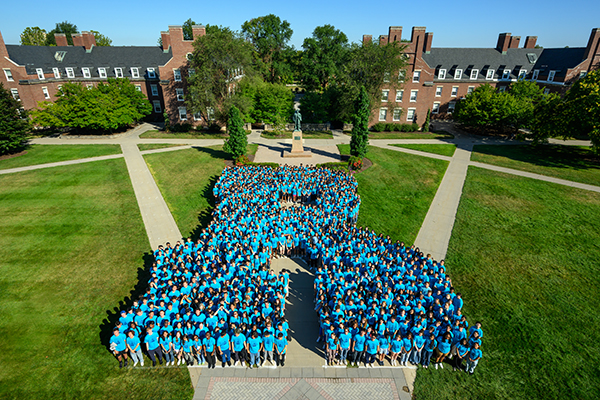 An aerial view of members of the Class of 2029 gathered on the quad in the form of the Rochester R.
