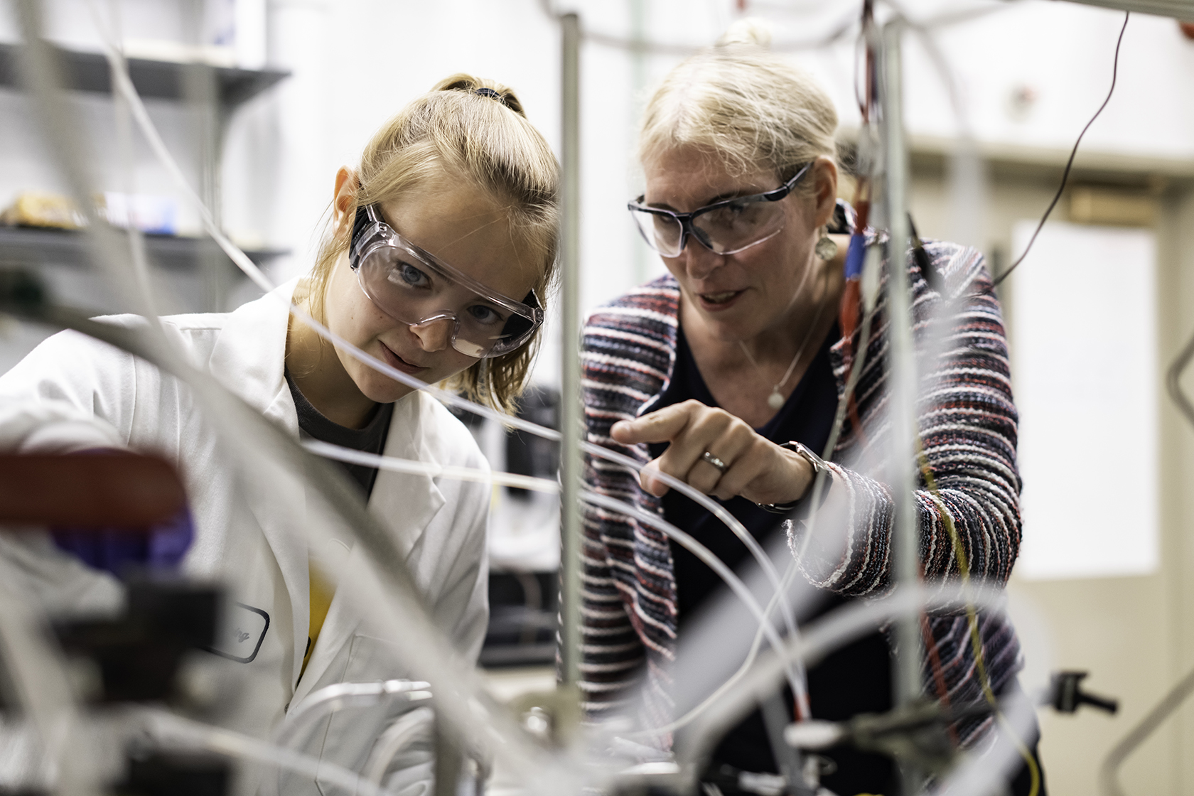 A professor and a student working together in a lab.