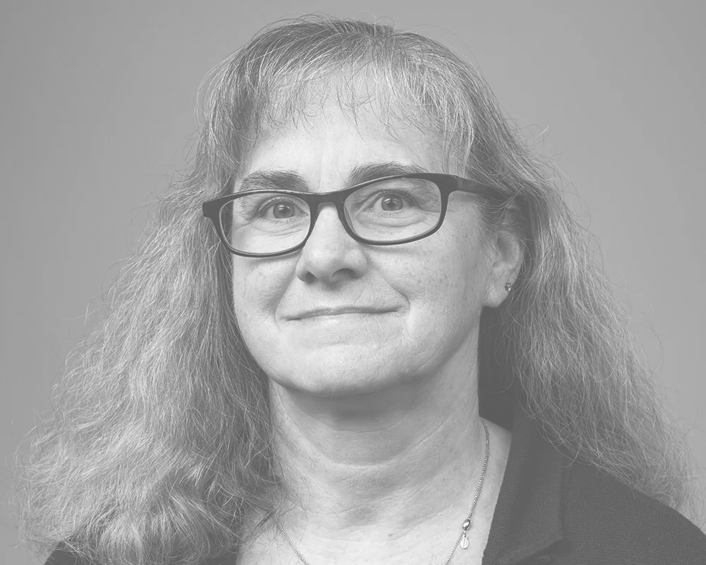 Elaine's headshot in black and white.