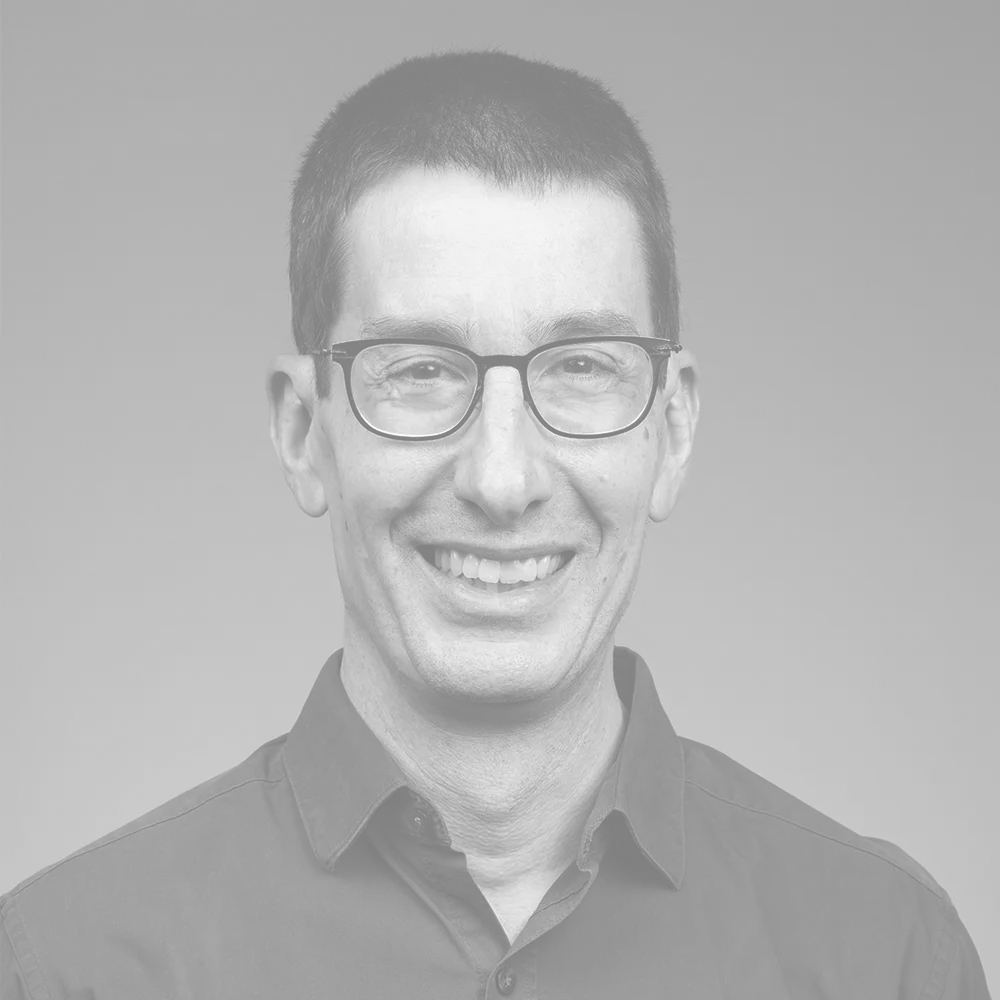 Kevin's headshot in black and white.