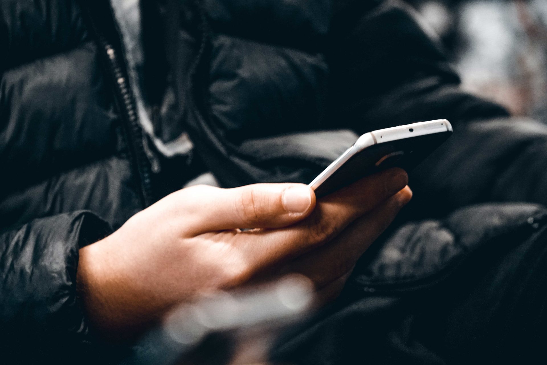 anonymous person holding a phone