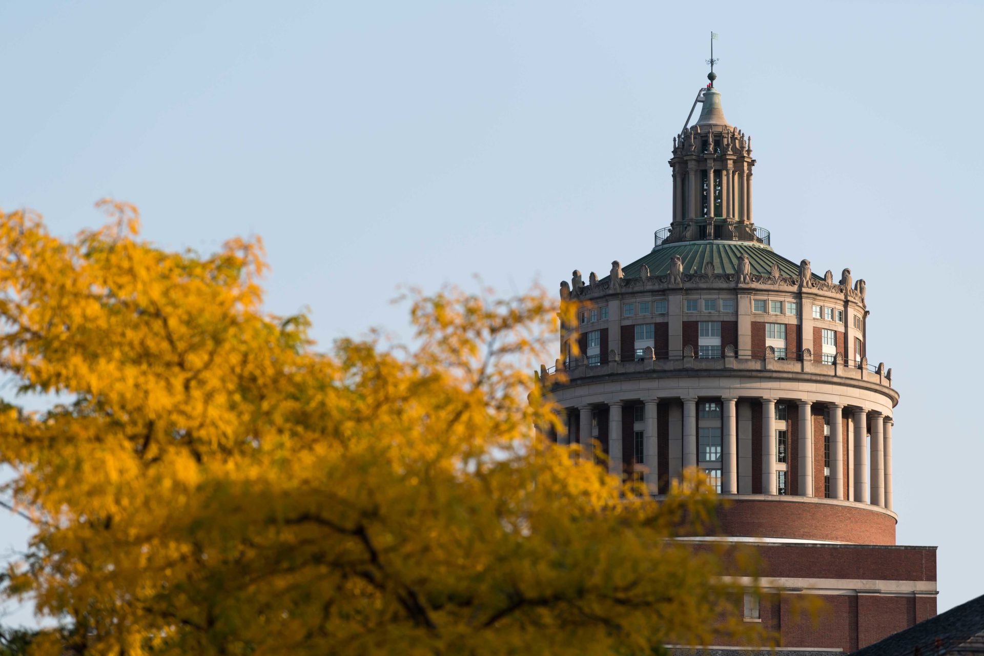 Rush Rhees Library with autumn foliage in the foreground